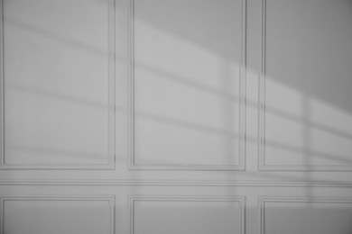 Photo of Shadow from window on dark grey wall indoors