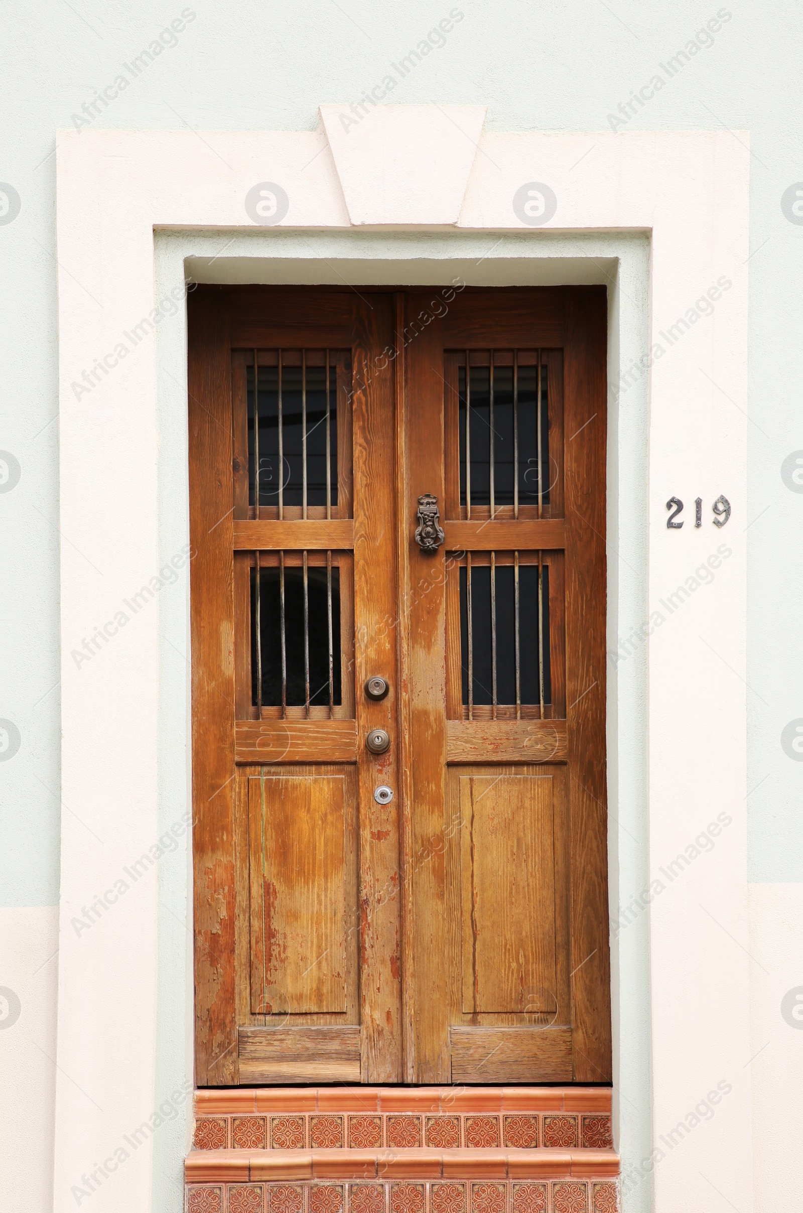 Photo of Entrance of residential house with wooden door