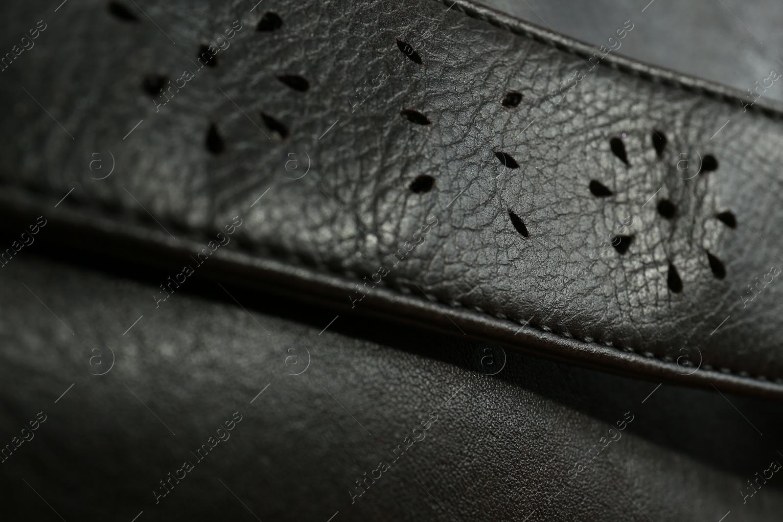 Photo of Texture of black leather as background, closeup