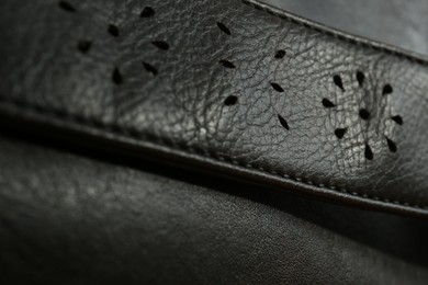 Photo of Texture of black leather as background, closeup