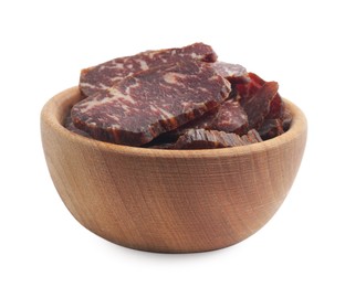 Photo of Delicious beef jerky in wooden bowl isolated on white