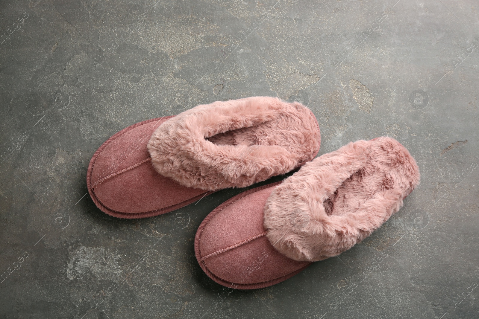 Photo of Pair of stylish soft slippers on grey background, flat lay