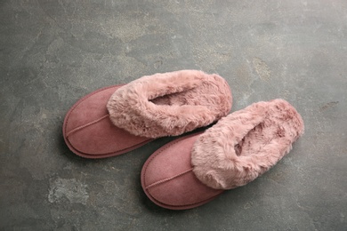 Pair of stylish soft slippers on grey background, flat lay