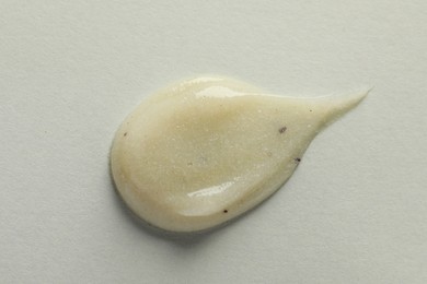 Photo of Sample of scrub on light background, top view