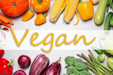 Image of Word Vegan and fresh vegetables on white wooden background, flat lay