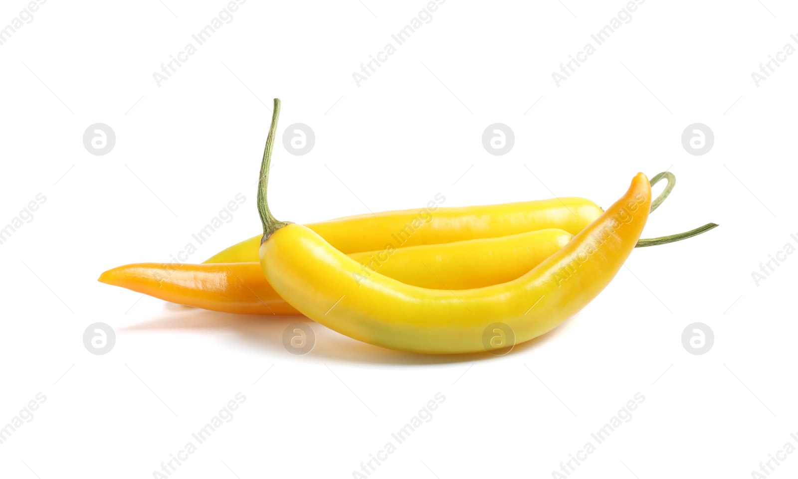 Photo of Ripe yellow hot chili peppers isolated on white