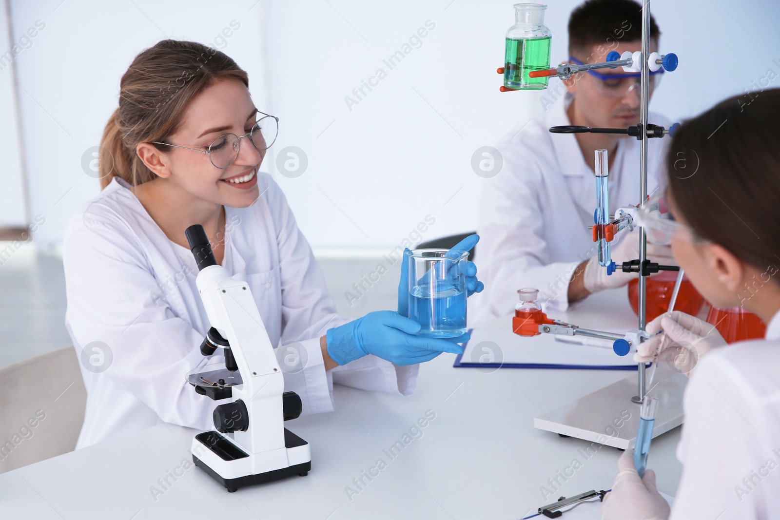 Photo of Medical students working in modern scientific laboratory