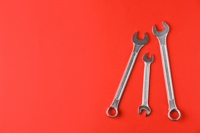 New wrenches on color background, top view with space for text. Plumber tools