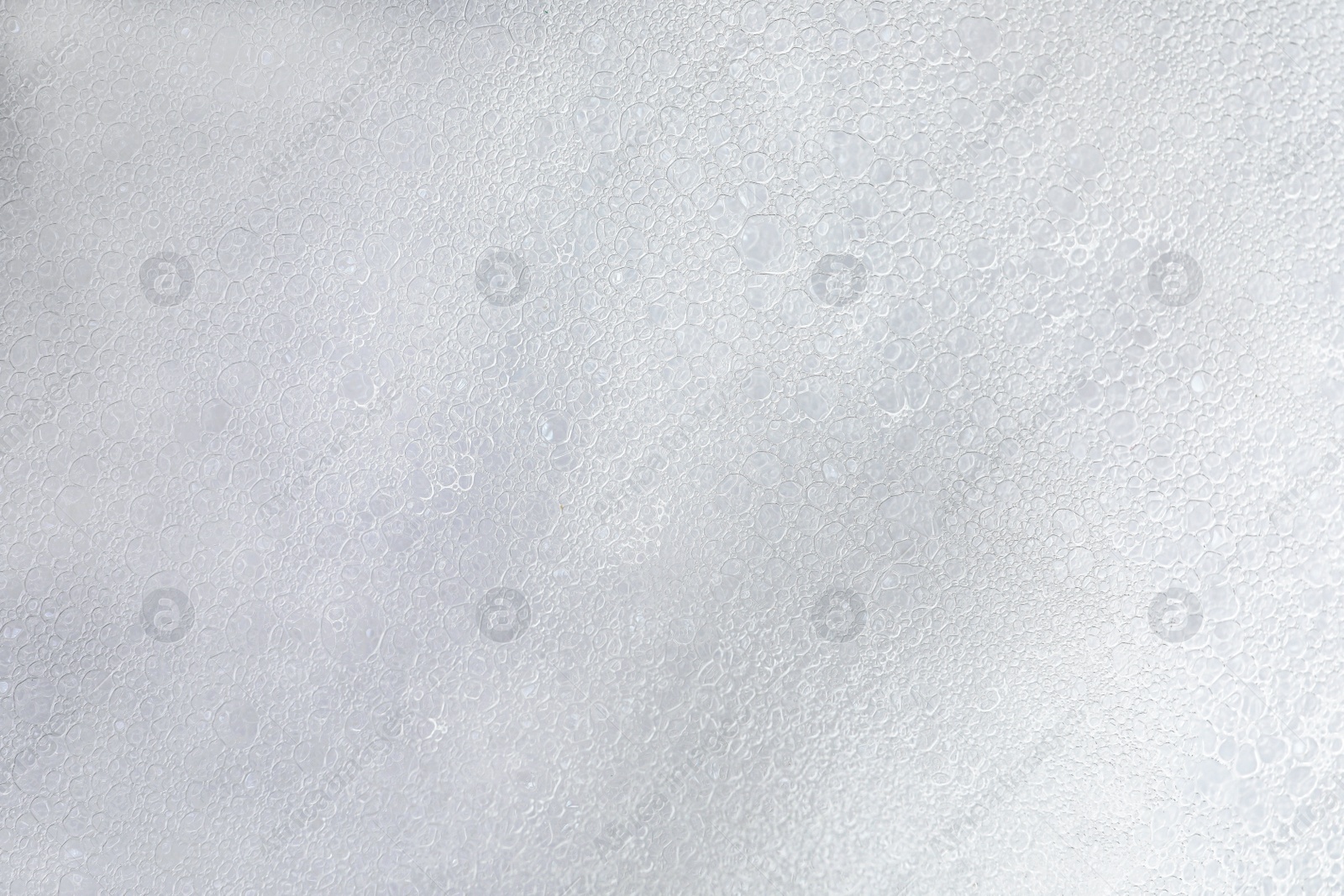 Photo of Fluffy soap foam as background, top view