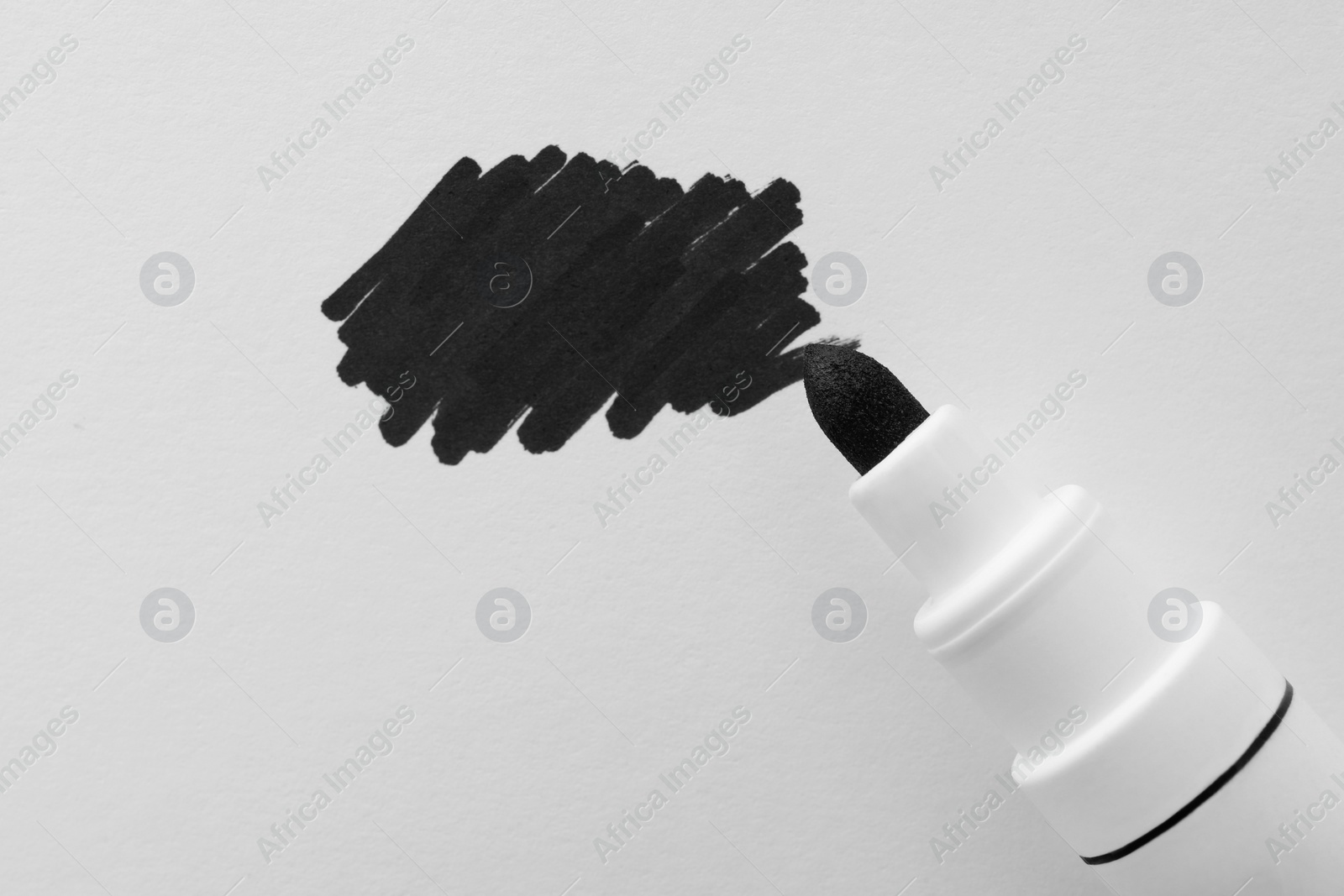 Photo of Stroke drawn with black marker and highlighter isolated on white, top view