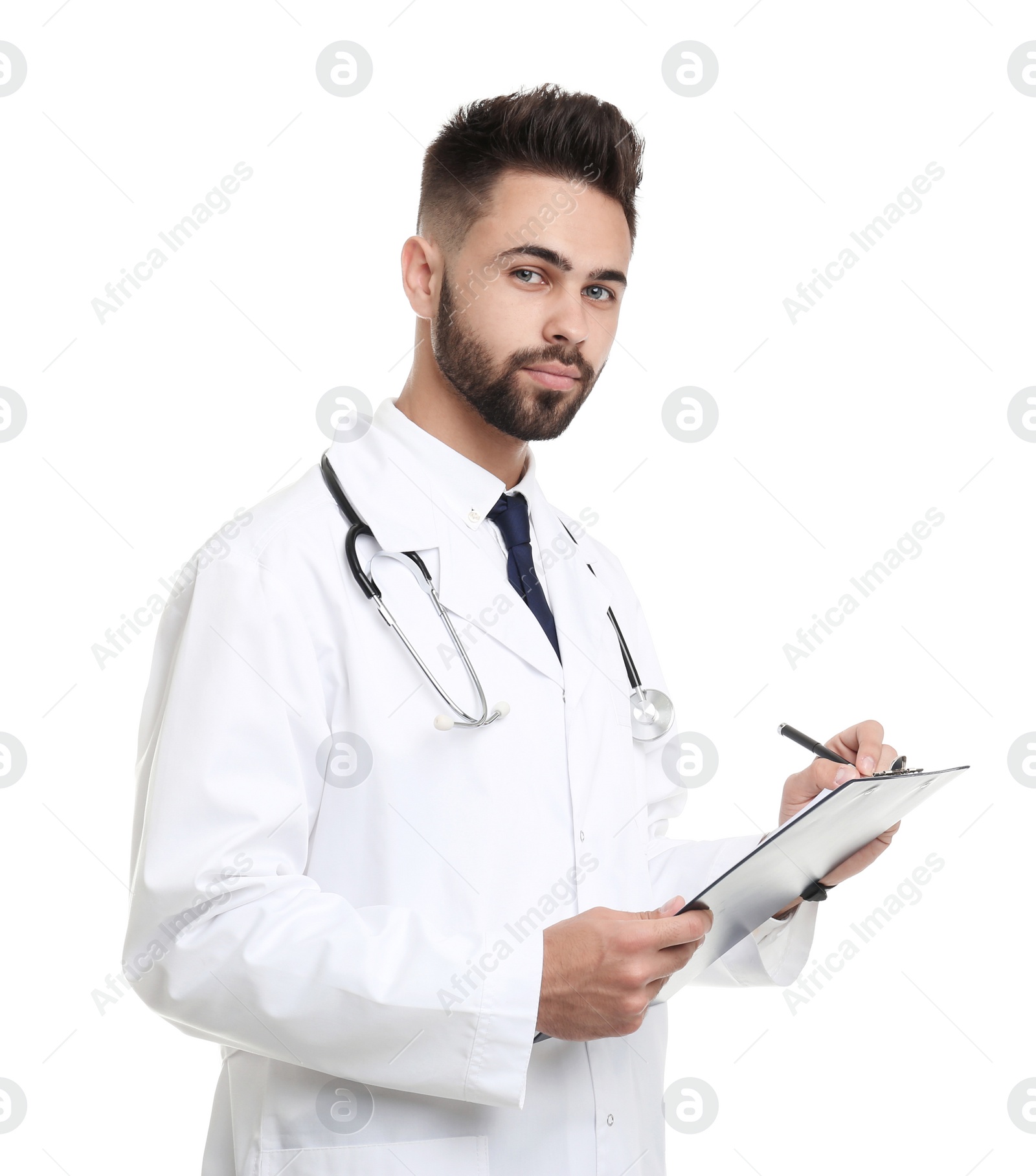 Photo of Young male doctor in uniform with clipboard isolated on white