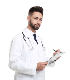 Photo of Young male doctor in uniform with clipboard isolated on white