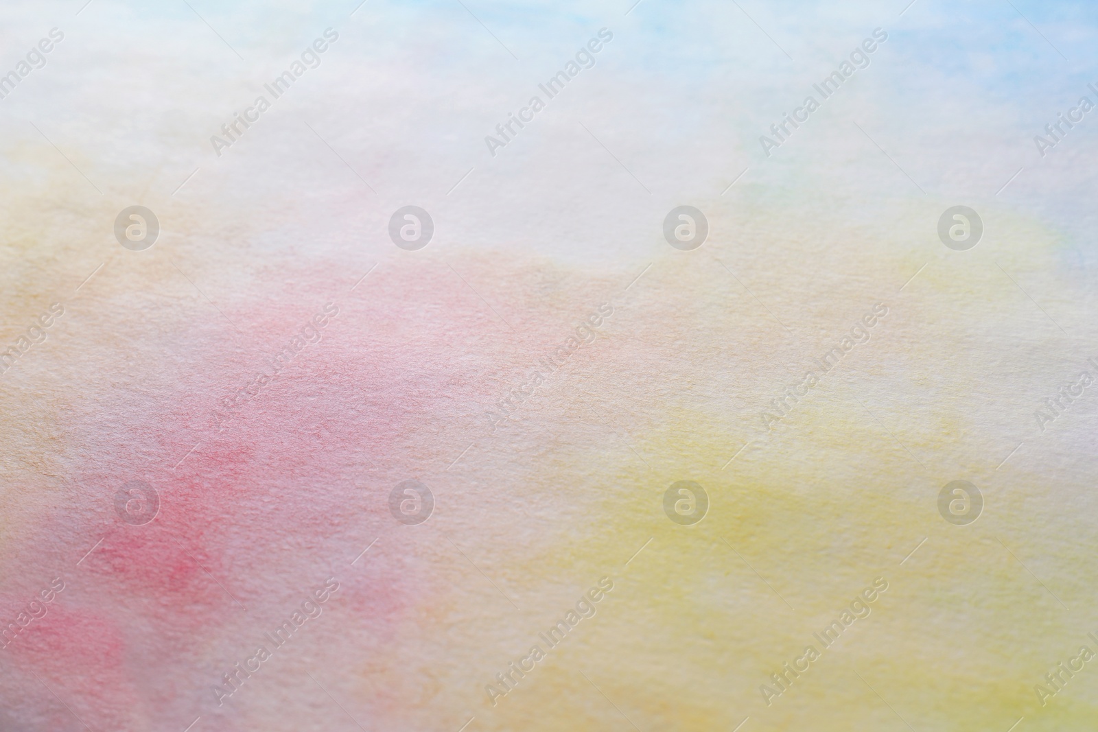 Photo of Colorful paints on white paper. Abstract background