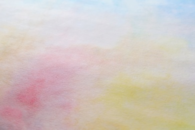 Photo of Colorful paints on white paper. Abstract background