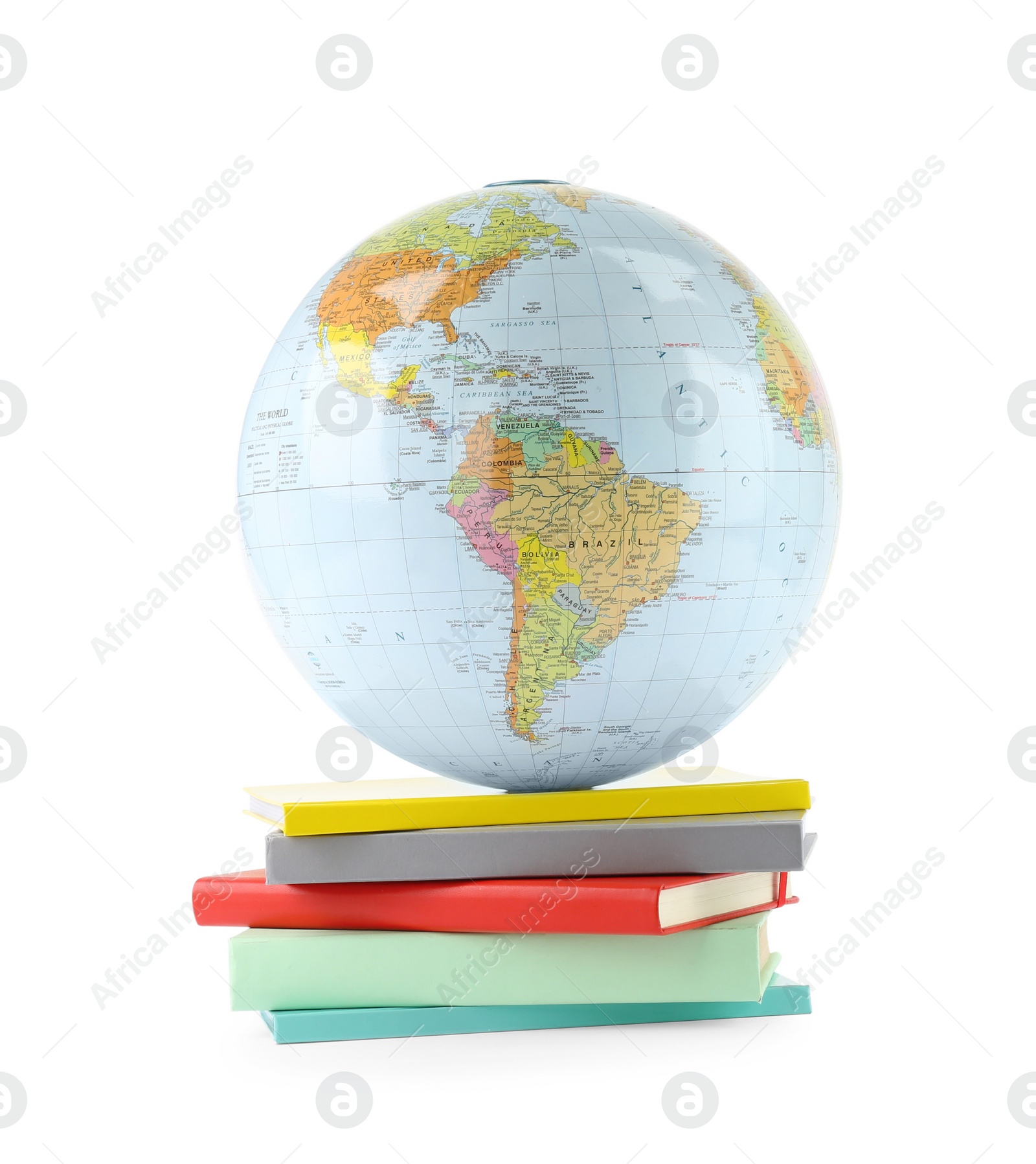 Photo of Plastic model globe of Earth and books on white background. Geography lesson