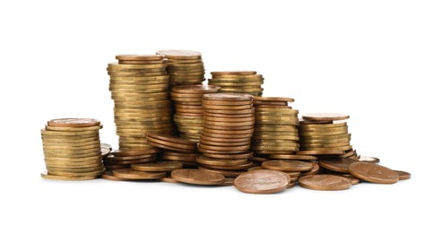 Stacks of different coins on white background