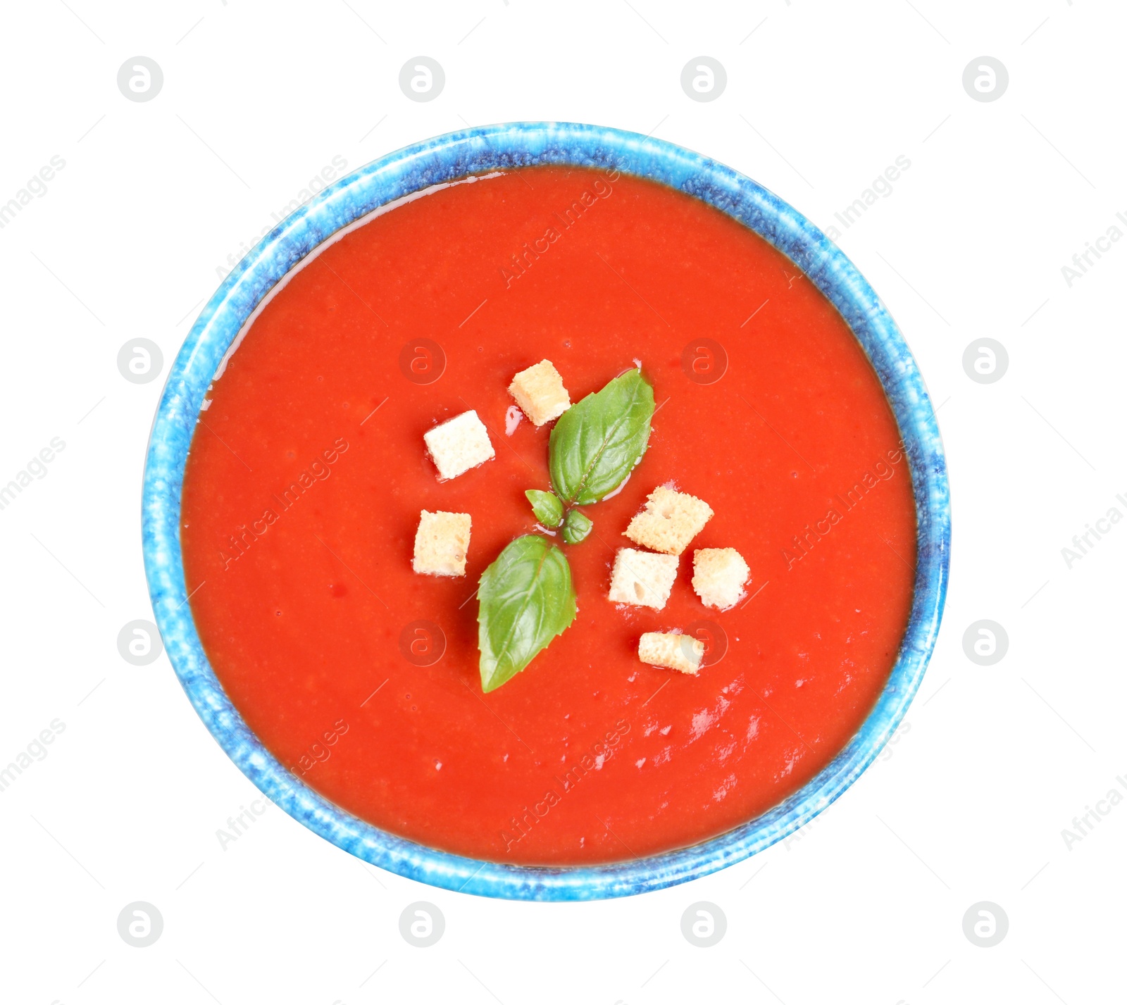 Photo of Bowl with fresh homemade tomato soup on white background, top view