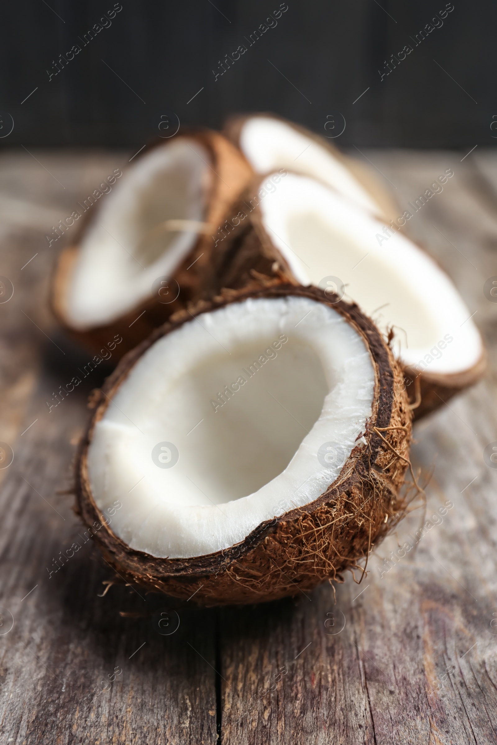 Photo of Fresh yummy coconuts on wooden table