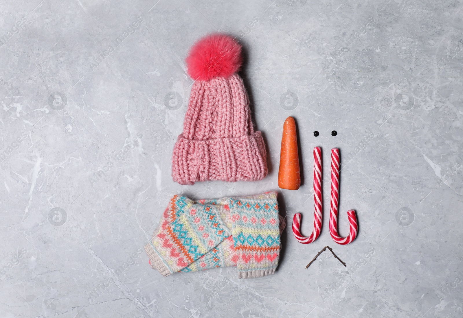 Photo of Set of elements for snowman on light grey marble background, flat lay