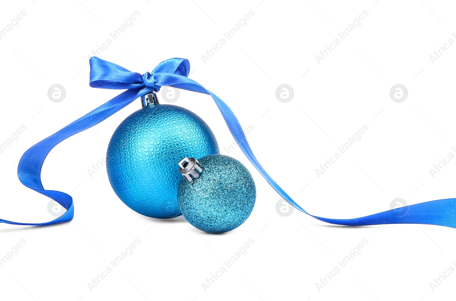 Photo of Beautiful Christmas balls and blue ribbon isolated on white