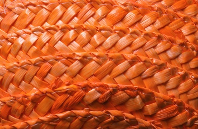 Orange wicker woven texture as background, closeup