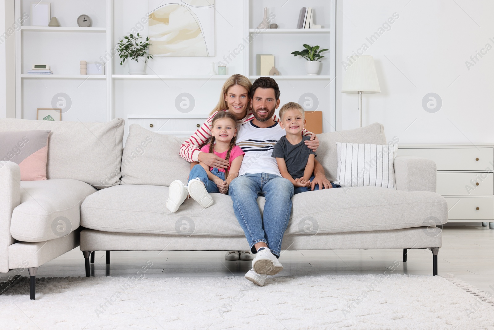 Photo of Portrait of happy family with children on sofa at home