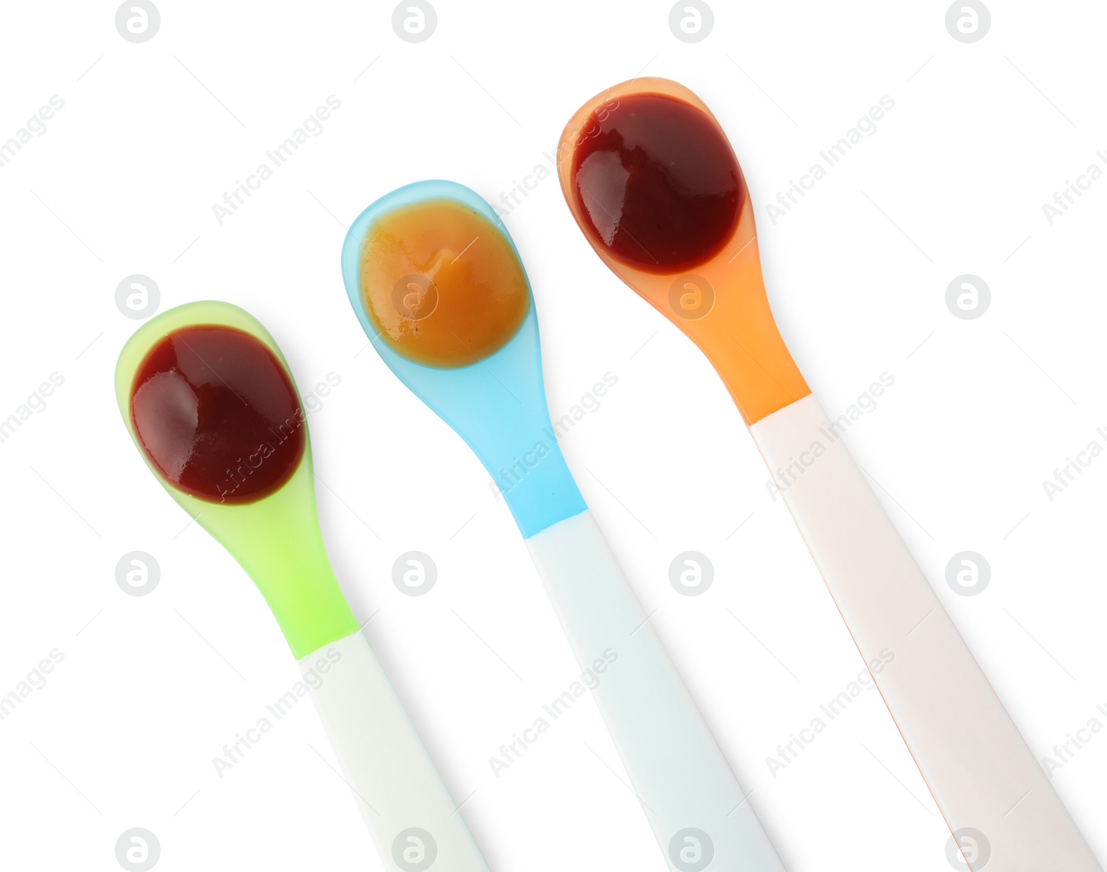 Photo of Healthy baby food in spoons on white background, top view