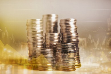 Double exposure of stacked coins and charts on light background