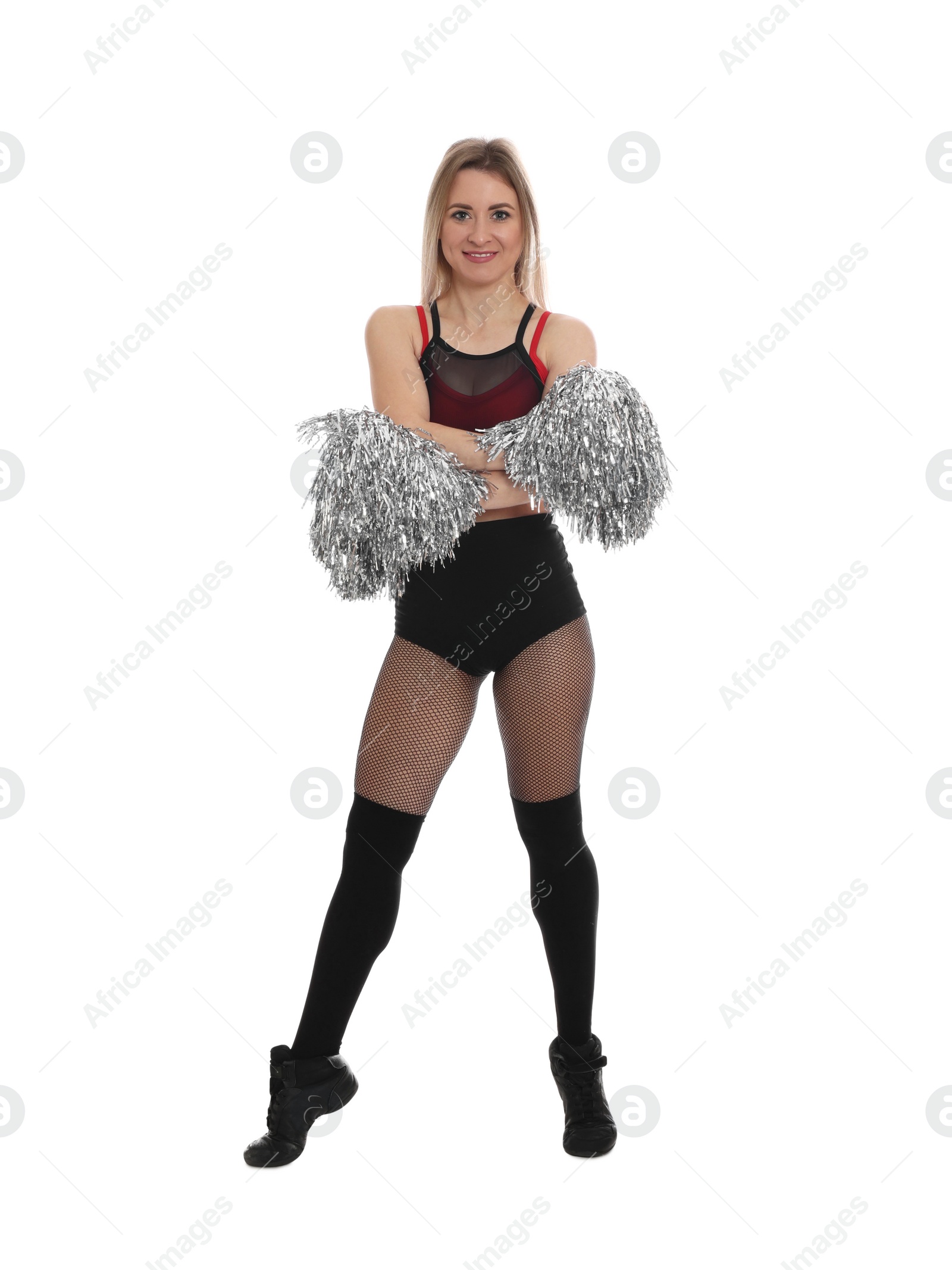 Photo of Beautiful cheerleader in costume holding pom poms on white background