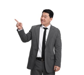 Photo of Businessman in suit pointing at something on white background