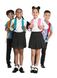 Photo of Happy children in school uniform on white background