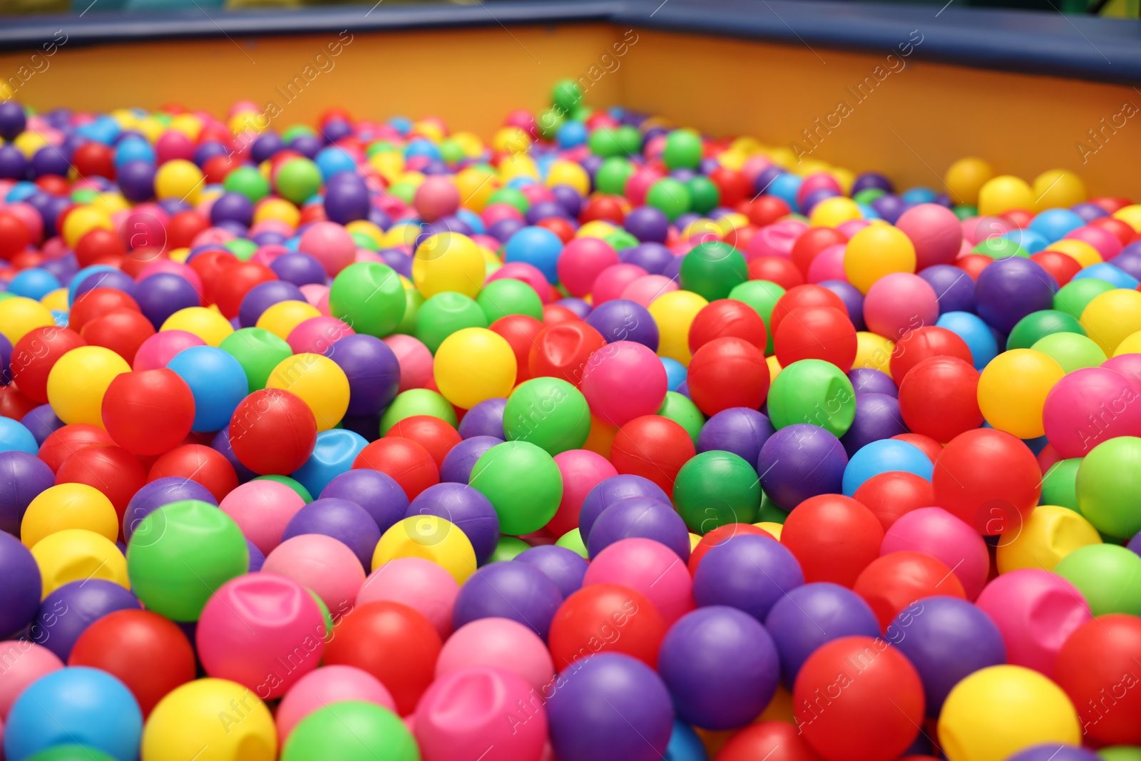 Photo of Ball pit with many colorful balls in play room