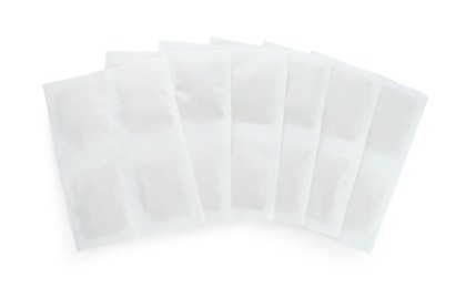 Photo of Mustard plasters on white background, top view