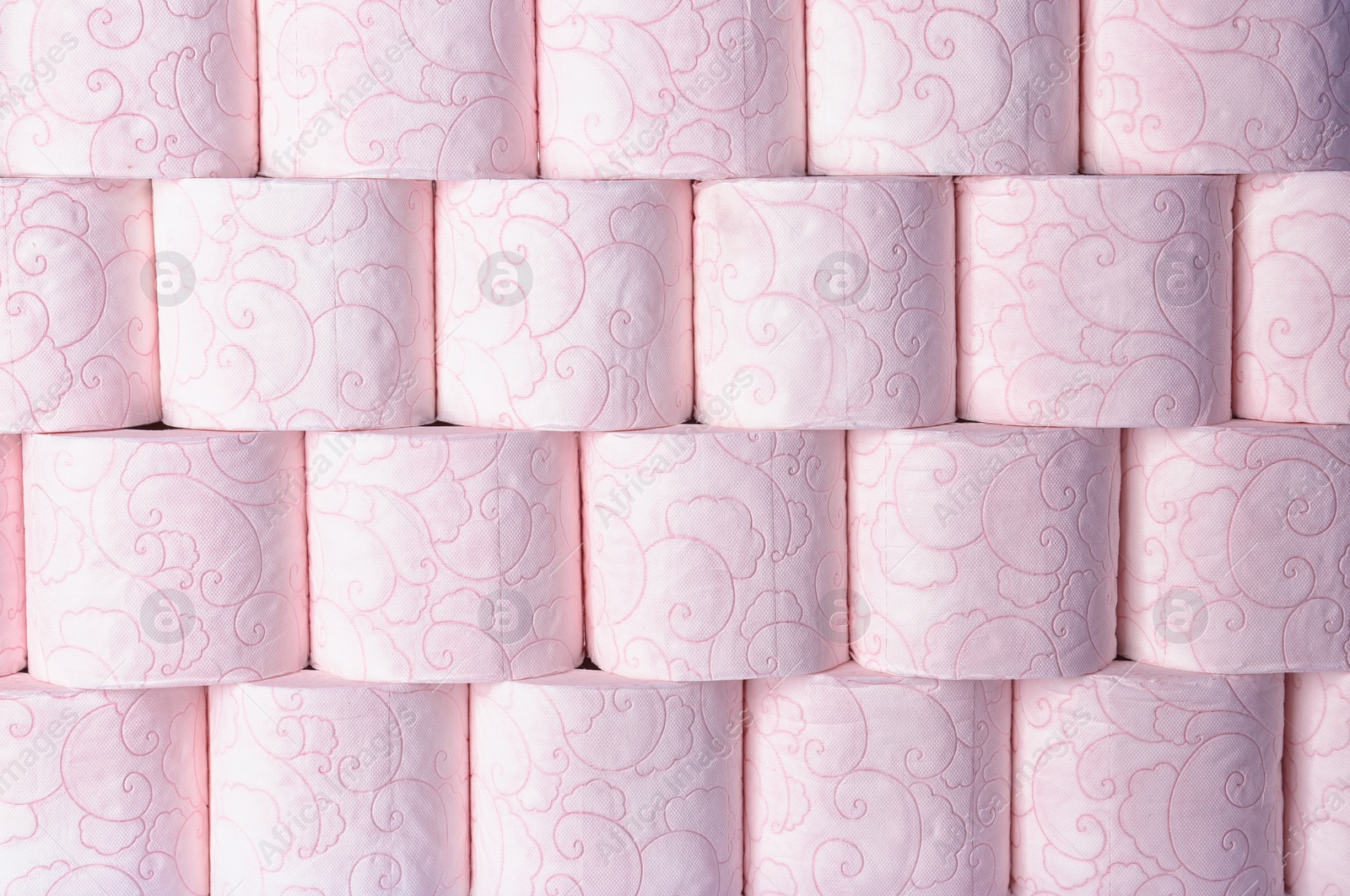 Photo of Many rolls of toilet paper as background. Personal hygiene