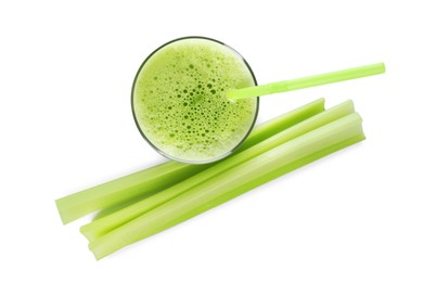 Glass of celery juice and fresh vegetable on white background, top view