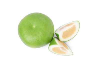 Whole and cut sweetie fruits on white background, top view