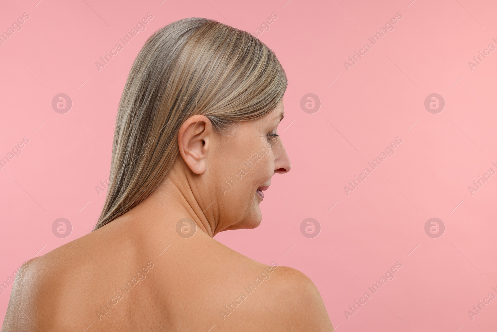 Photo of Beautiful woman with healthy skin on pink background, space for text