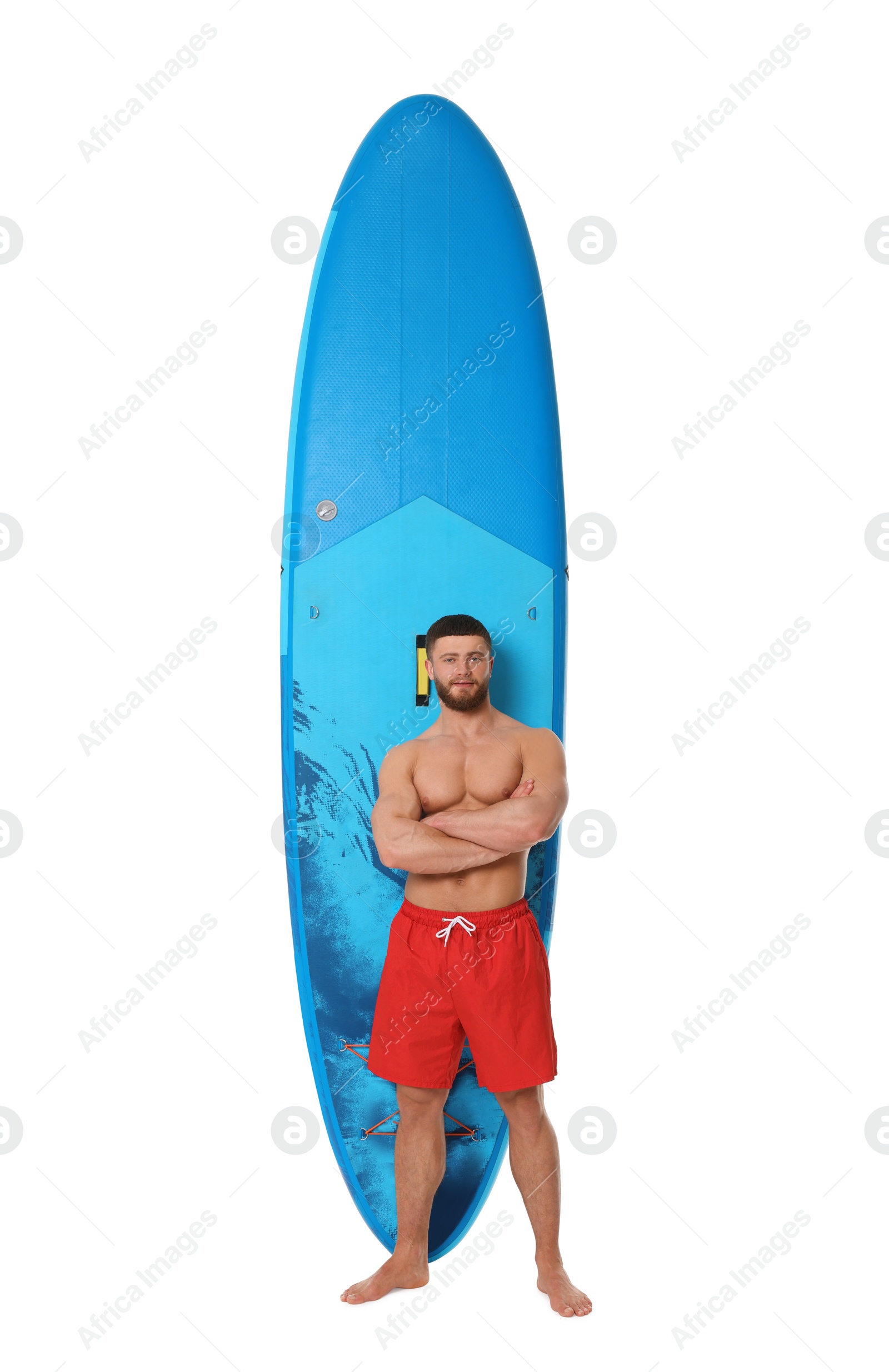 Photo of Handsome man with blue SUP board on white background