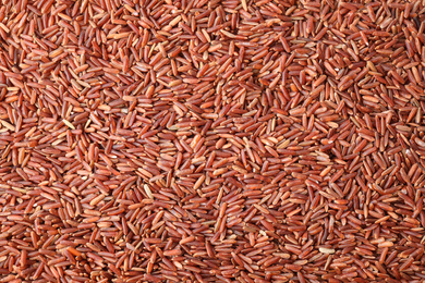 Photo of Top view of brown rice as background