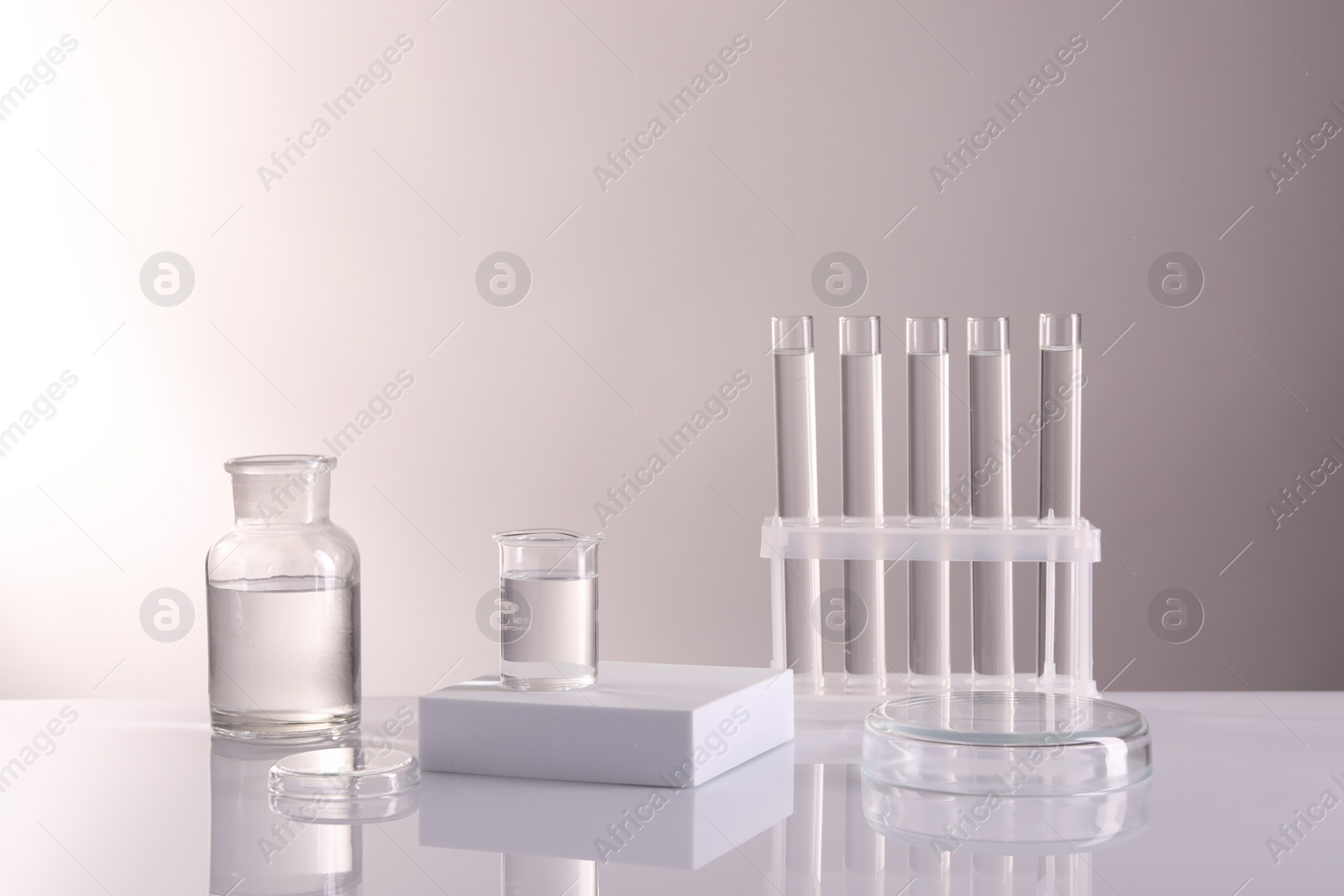 Photo of Laboratory analysis. Different glassware on table against light background