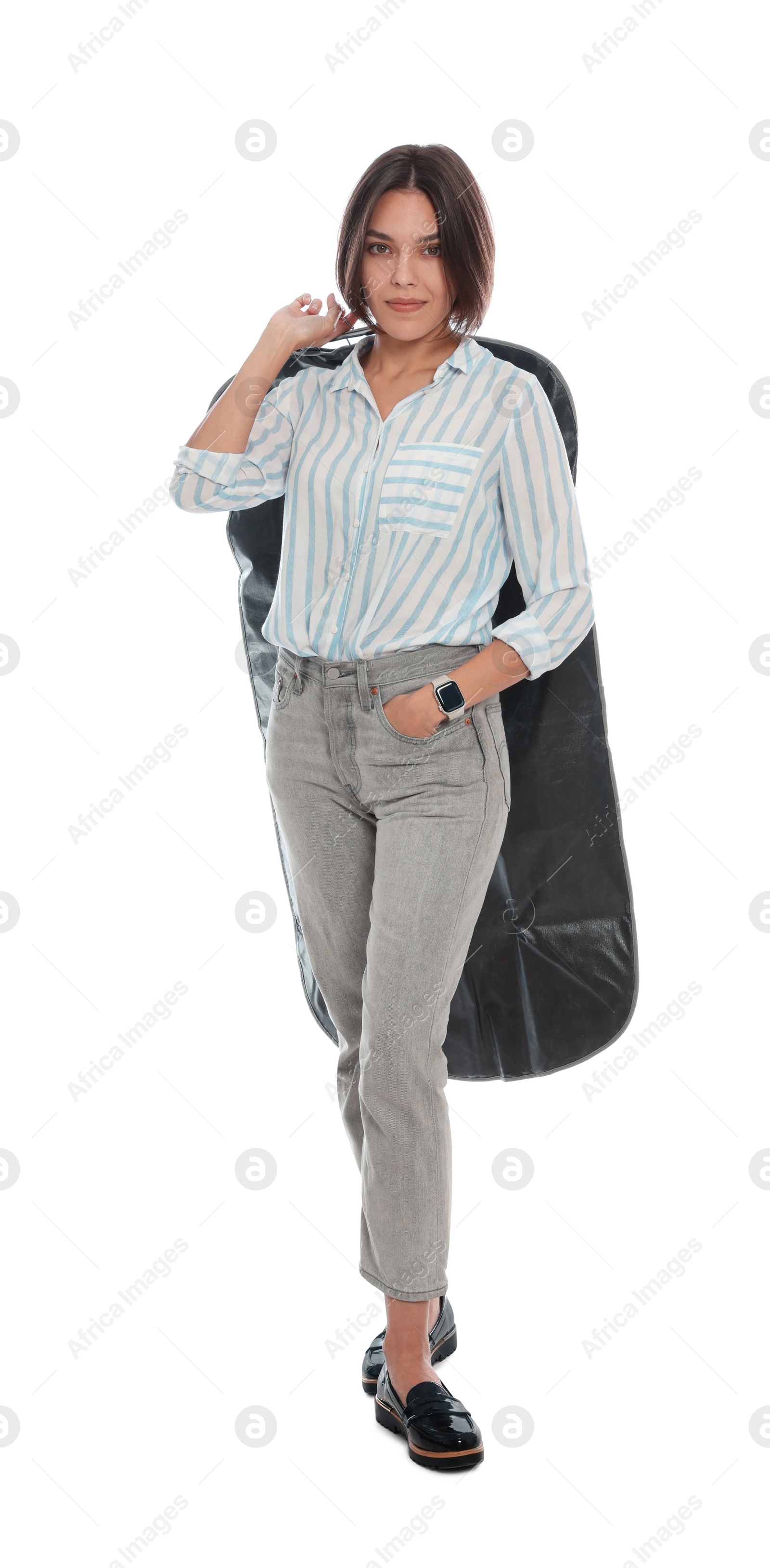 Photo of Woman holding garment cover with clothes on white background. Dry-cleaning service