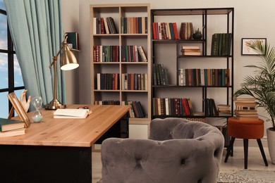 Photo of Cozy home library interior with collection of different books on shelves