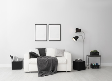 Photo of Elegant white sofa in modern living room interior