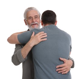 Happy dad and his son hugging on white background