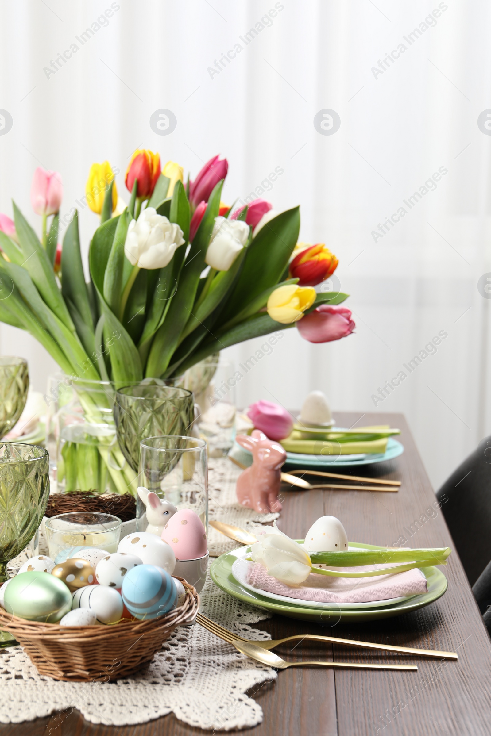 Photo of Festive table setting with beautiful flowers. Easter celebration