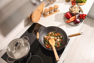 Photo of Frying pan with mix of fresh vegetables, above view