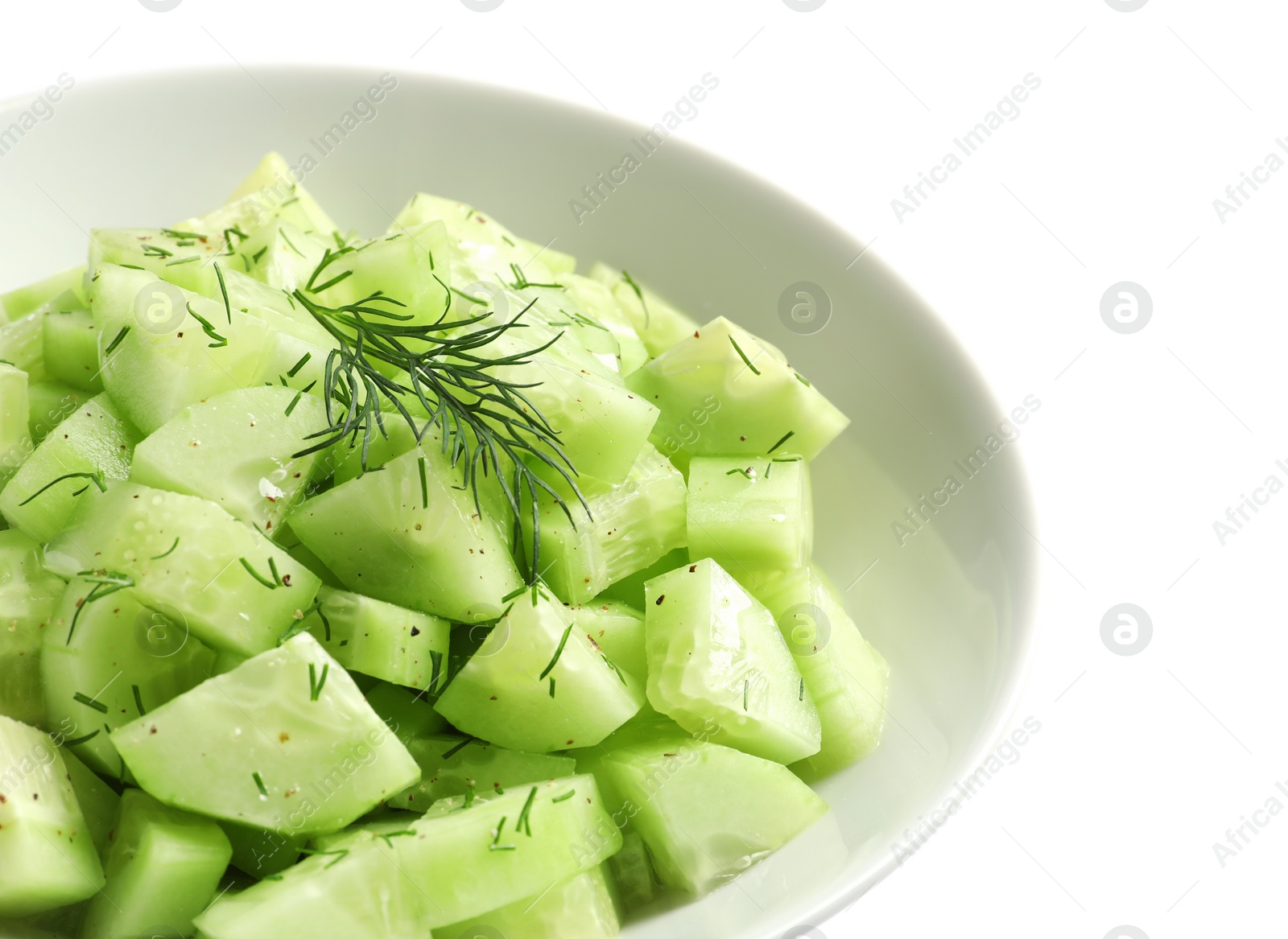 Photo of Delicious cucumber salad with dill in bowl on white background, closeup