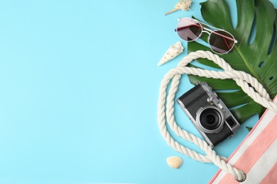 Photo of Flat lay composition with different beach objects on color background, space for text