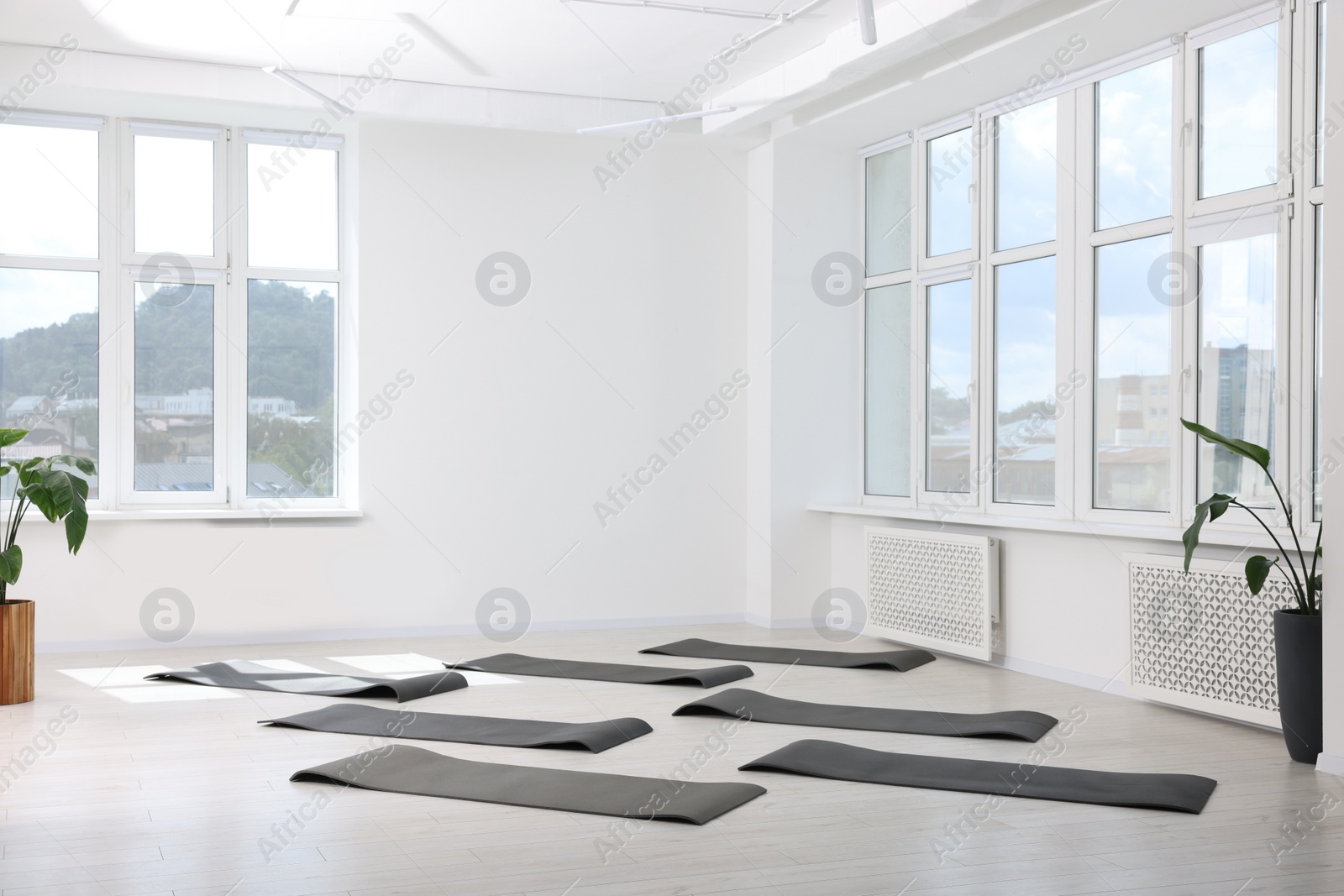 Photo of Spacious yoga studio with exercise mats and big windows