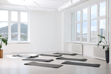 Photo of Spacious yoga studio with exercise mats and big windows